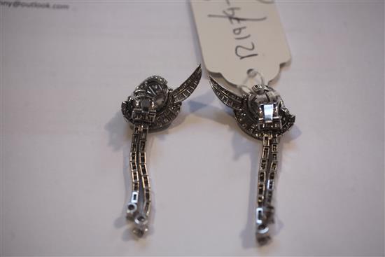 A nice pair of platinum and diamond encrusted scrolling and double drop earrings, 6.5cm.
